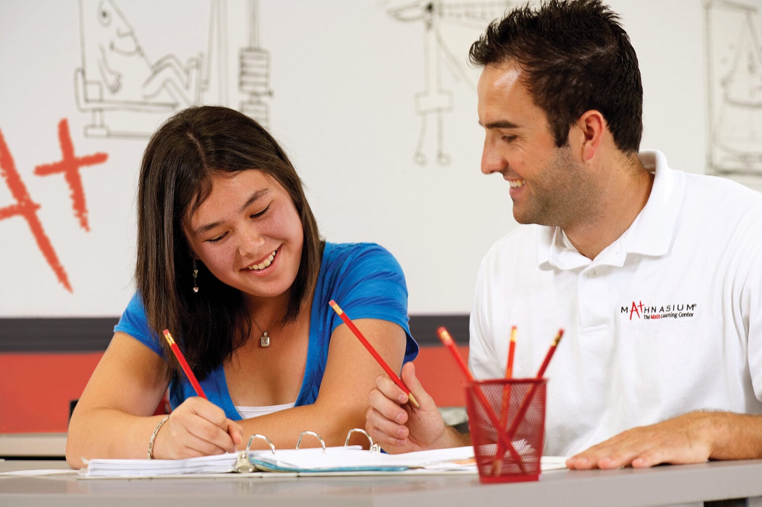 Mathnasium franchise childhood education tutor with teenage girl