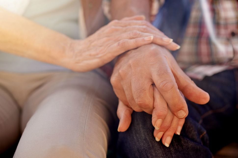 Senior Care Authority holding hands